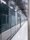 Passing daylight inside office building on modern glass building interior corridor