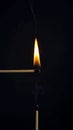 Passing the Flame from One Match to Another in the Dark Royalty Free Stock Photo