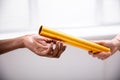 Passing Golden Relay Baton To Other Person Royalty Free Stock Photo