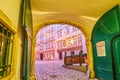 Passing medieval archway with old wooden doors in old town, on February 17 in Vienna, Austria