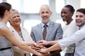 Passing our success from one to another. a group of businesspeople putting their hands together in unity. Royalty Free Stock Photo