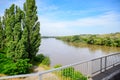 Passing over the bridge over river. The landscape of the river, the surface and the trees of the river\'s waterplain Royalty Free Stock Photo