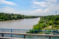 Passing over the bridge over river. The landscape of the river, the surface and the trees of the river\'s waterplain Royalty Free Stock Photo