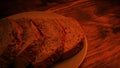 Plate Of Sliced Bread On Table In Firelight