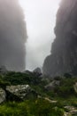 Passing a rock gorge with steep walls while hiking Royalty Free Stock Photo