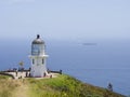 Passing ship at Cape Reinga Lighthouse, north edge of New Zealand Royalty Free Stock Photo