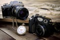 The passing of time measured by the hands of a clock and the technological progress of the cameras Royalty Free Stock Photo