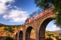 Passing train on old brick made bridge in Lorestan Royalty Free Stock Photo