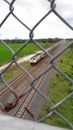 A passing train is seen from the pedestrian bridge in Purworejo:Indonesia