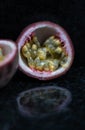 Passion fruit close up on black stone background Royalty Free Stock Photo