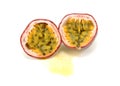 Passion Fruit Cut In Half Showing Yellow Pulp Around Seeds