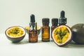 Passion fruit essential oil in a brown glass bottle, alternative medicine. Natural organic essence. Passion fruit seed oil