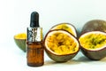 Passion fruit essential oil in a brown glass bottle, alternative medicine. Natural organic essence. Passion fruit seed oil