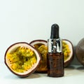 Passion fruit essential oil in a brown glass bottle, alternative medicine. Natural organic essence. Passion fruit seed oil