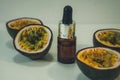 Passion fruit essential oil in a brown glass bottle, alternative medicine. Natural organic essence. Passion fruit seed oil