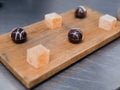 Passion Fruit Tart & Chi Chocolate Dessert Pieces on Wood