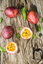 Passion fruit on a wooden board with knife Royalty Free Stock Photo