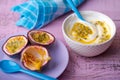 Passion fruit and yogurt on the rustic table Royalty Free Stock Photo