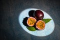 Passion fruits on dark background. Set of whole and half of fresh passion fruit. place for text, top view Royalty Free Stock Photo