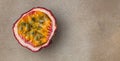 Passion fruits on dark background. Set of whole and half of fresh passion fruit. place for text, top view Royalty Free Stock Photo