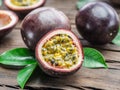 Passion fruits and its cross section with pulpy juice filled with seeds. Wooden background