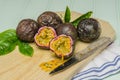 Passion fruits with leaves, knife and white flowers in jar Royalty Free Stock Photo