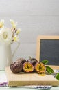 Passion fruits with leaves, knife and white flowers in jar Royalty Free Stock Photo