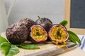 Passion fruits with leaves, knife and white flowers in jar Royalty Free Stock Photo