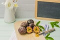 Passion fruits with leaves, knife and white flowers in jar Royalty Free Stock Photo