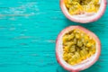 Passion fruits on wooden background,close up of fresh purple passion fruits harvest from farm,Half cut passion fruit. Royalty Free Stock Photo