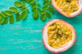 Passion fruits on wooden background,close up of fresh purple passion fruits harvest from farm,Half cut passion fruit. Royalty Free Stock Photo