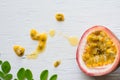 Passion fruits on wooden background,close up of fresh purple passion fruits harvest from farm,Half cut passion fruit. Royalty Free Stock Photo