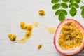 Passion fruits on wooden background,close up of fresh purple passion fruits harvest from farm,Half cut passion fruit. Royalty Free Stock Photo