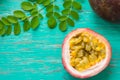 Passion fruits on wooden background,close up of fresh purple passion fruits harvest from farm,Half cut passion fruit. Royalty Free Stock Photo