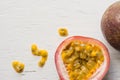 Passion fruits on wooden background,close up of fresh purple passion fruits harvest from farm,Half cut passion fruit. Royalty Free Stock Photo