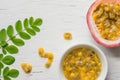 Passion fruits on wooden background,close up of fresh purple passion fruits harvest from farm,Half cut passion fruit. Royalty Free Stock Photo