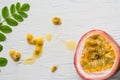 Passion fruits on wooden background,close up of fresh purple passion fruits harvest from farm,Half cut passion fruit. Royalty Free Stock Photo
