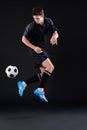 Without passion, life is nothing. Shot of a handsome soccer player isolated on black.