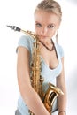 Passion look young blonde with saxophone