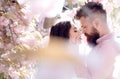 Passion and love concept. Couple kissing in blooming garden on spring day. Royalty Free Stock Photo