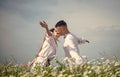 Passion pure love in chamomile field of kissing couple, man and woman Royalty Free Stock Photo