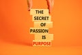 Passion and purpose symbol. Wooden blocks with concept words The secret of passion is purpose. Beautiful orange background, copy