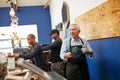 Passion is the secret to running a successful small business. a senior man working in a coffee shop. Royalty Free Stock Photo