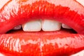 Passion. Sensual female lips. White healthy teeth. Mouth with teeth smile. Red lipstick and sexy kiss. Lips close up.