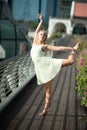 Passionate beautiful blonde female dancer jumps high in the air,
