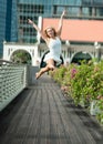 Passionate beautiful blonde female dancer jumps high in the air,