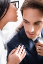 passionate businesswoman whispering in ear of Royalty Free Stock Photo