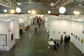 Passionate collectors and emerging artists meet at the international contemporary art fair `Artissima` wearing mandatory face mask