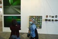 Passionate collectors and emerging artists meet at the international contemporary art fair `Artissima` wearing mandatory face mask