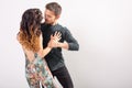 Passionate couple dancing social danse kizomba or bachata or semba or taraxia on white background with copy space Royalty Free Stock Photo